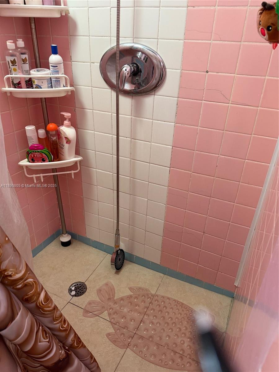 102 West 27th Street Hialeah, FL 33010 - Photo 19 of 26 a bathroom with a sink and a mirror