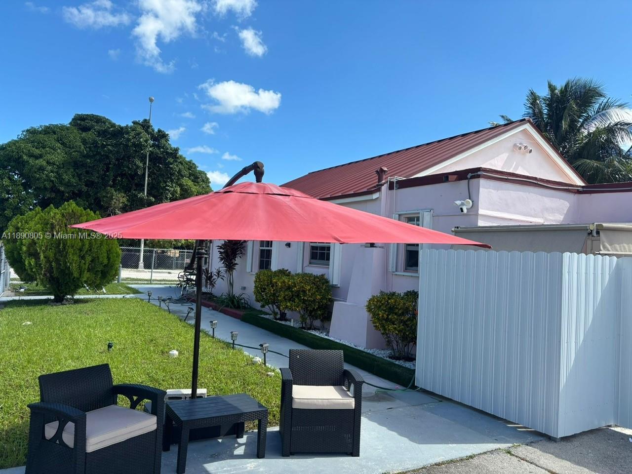 102 West 27th Street Hialeah, FL 33010 - Photo 21 of 26 a view of pool with outdoor seating