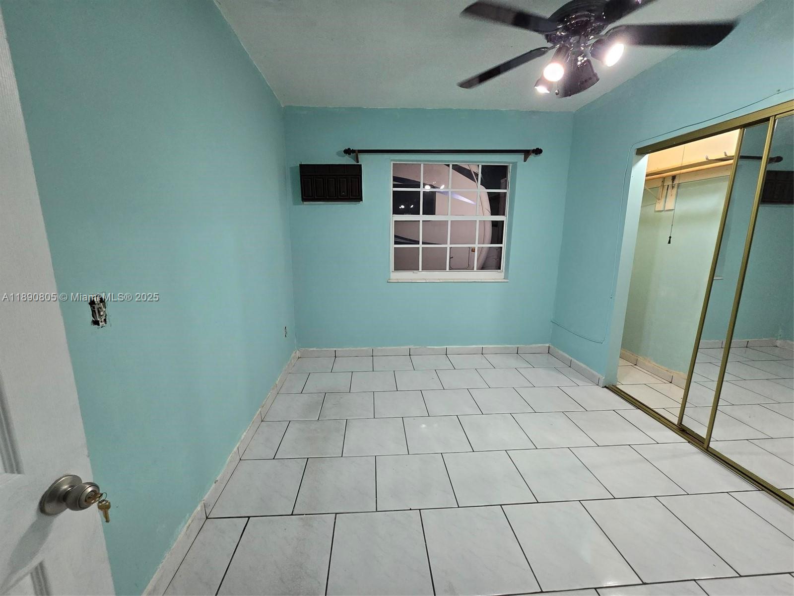 102 West 27th Street Hialeah, FL 33010 - Photo 9 of 26 a view of an empty room with a window
