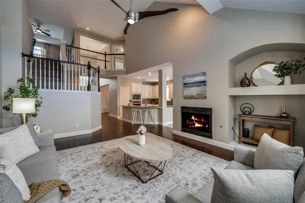 a living room with furniture a fireplace and a fireplace