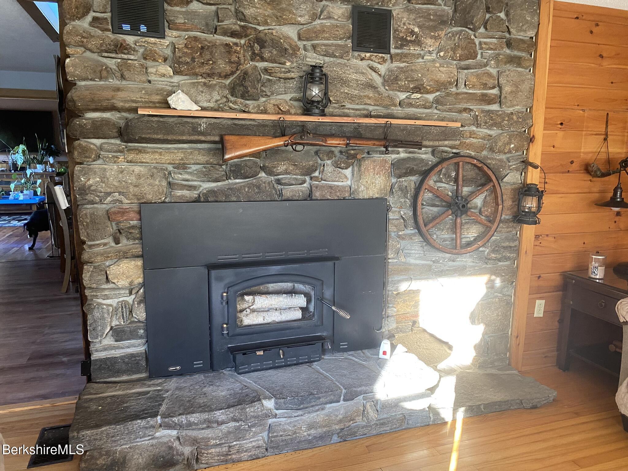 554 Main Street Becket, MA 01223 - Photo 11 of 36 a living room with fireplace