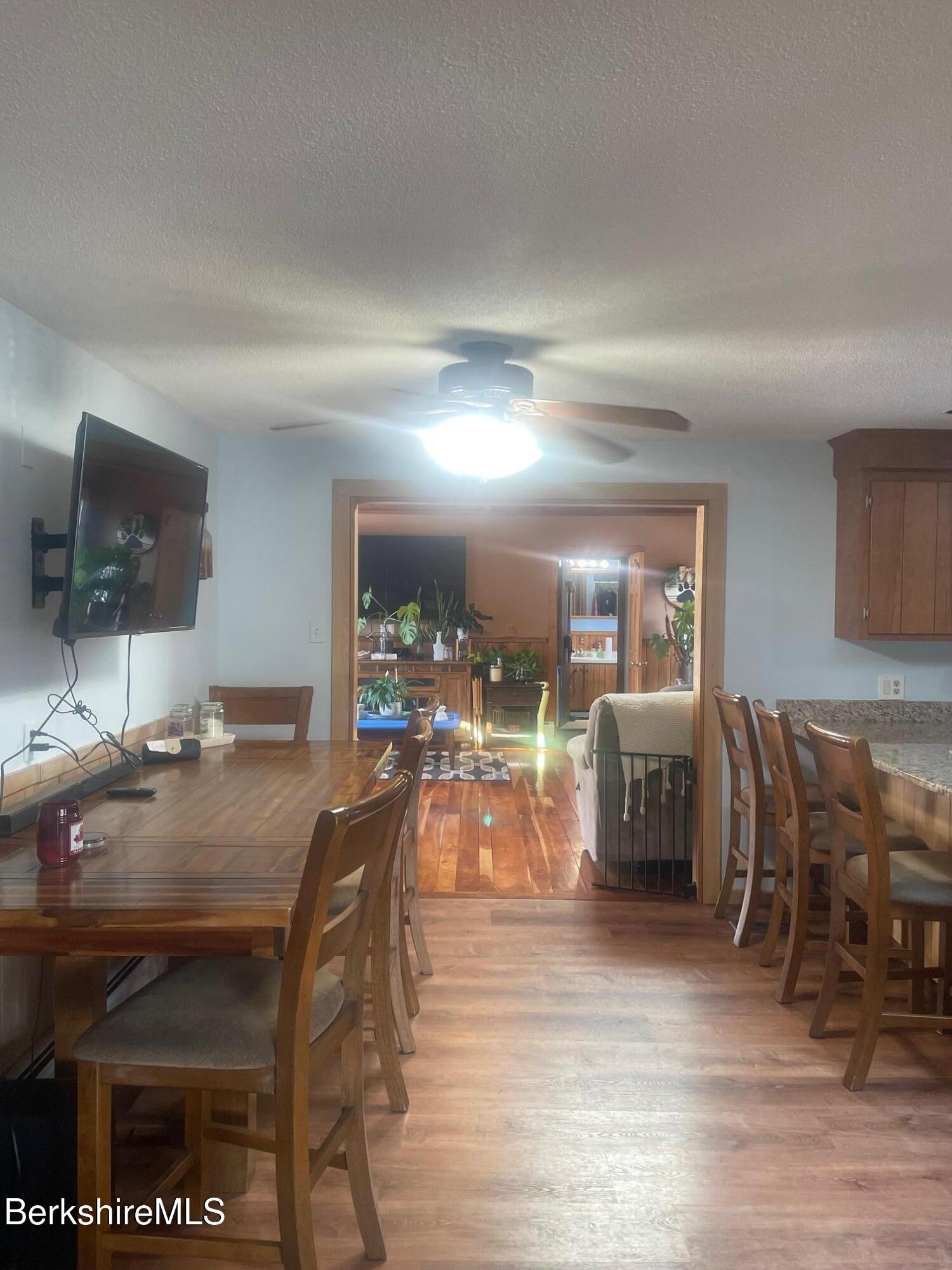 554 Main Street Becket, MA 01223 - Photo 12 of 36 a dining room with furniture and wooden floor