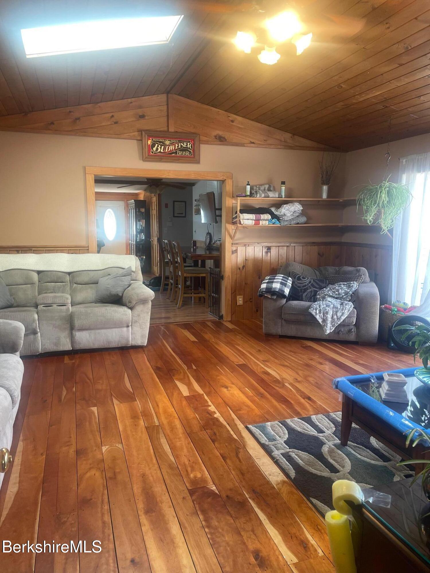554 Main Street Becket, MA 01223 - Photo 13 of 36 a living room with furniture and a chandelier