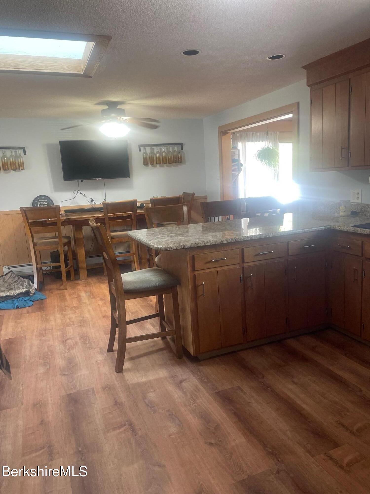 554 Main Street Becket, MA 01223 - Photo 15 of 36 a kitchen with lots of counter space sink and view living