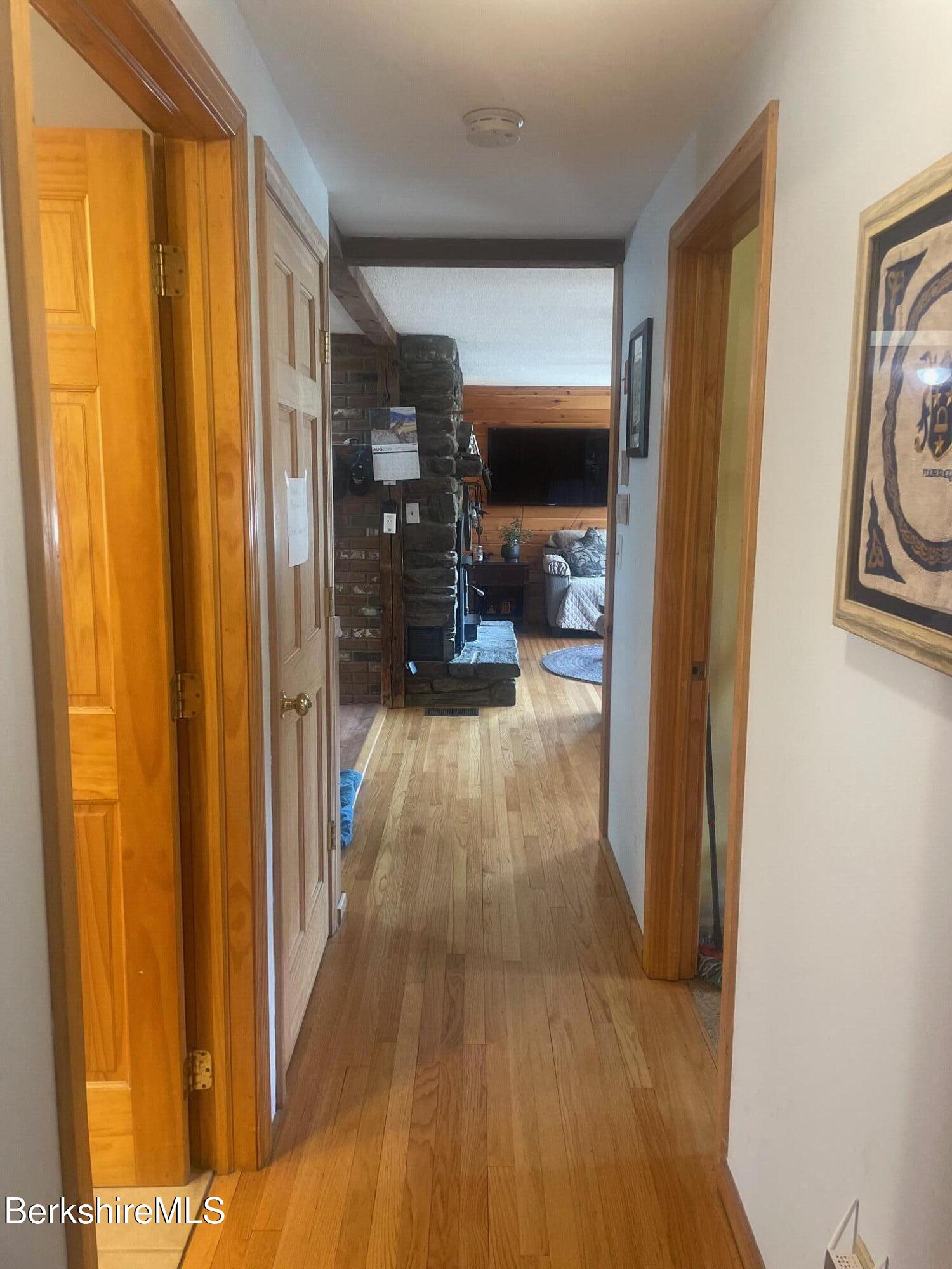 554 Main Street Becket, MA 01223 - Photo 16 of 36 a view of a hallway with wooden floor
