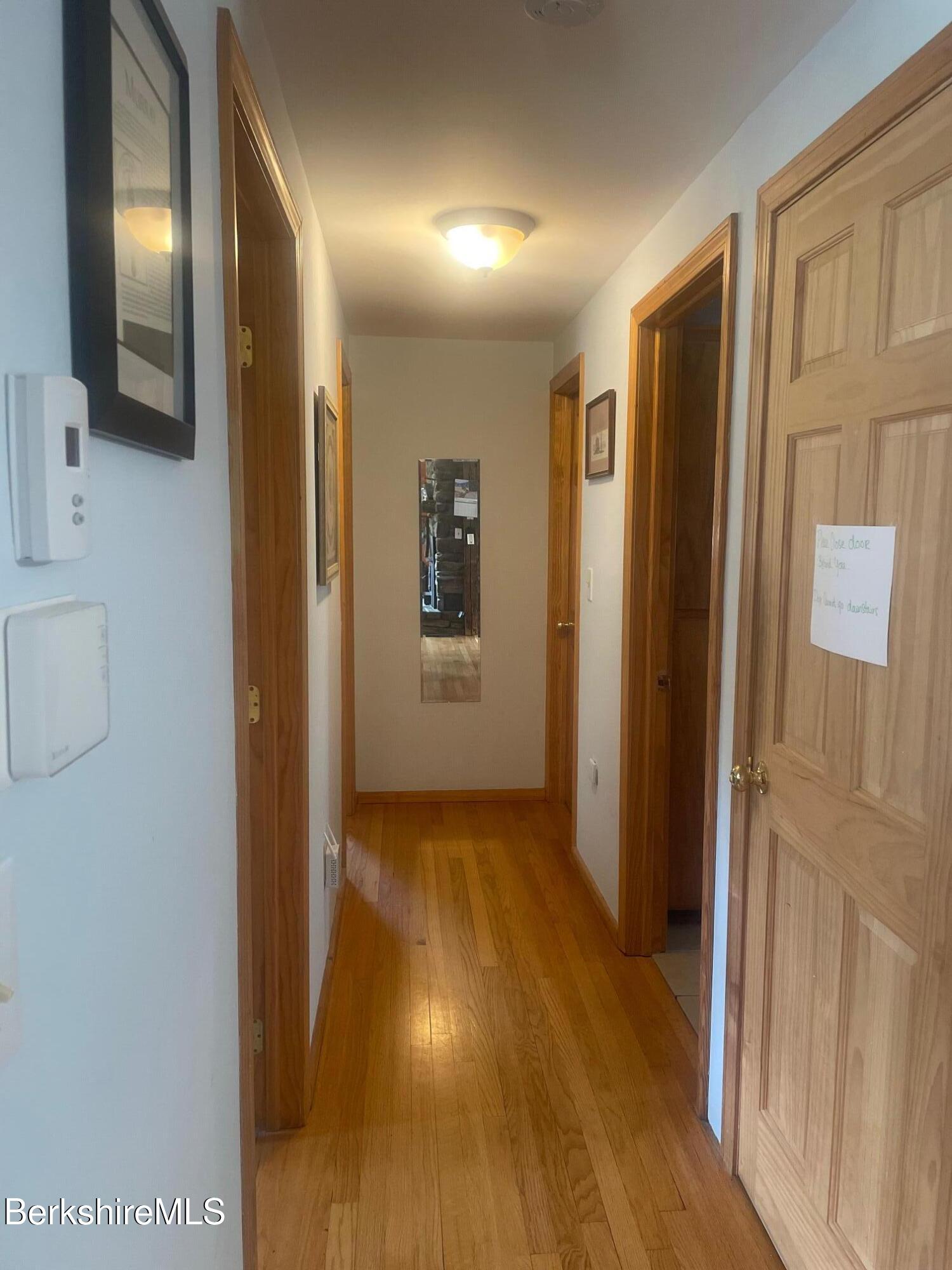 554 Main Street Becket, MA 01223 - Photo 17 of 36 a view of hallway with wooden floor
