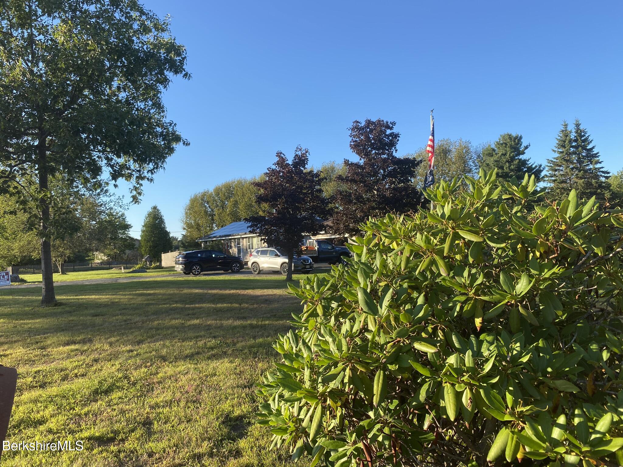 554 Main Street Becket, MA 01223 - Photo 21 of 36 a view of a grassy field with trees