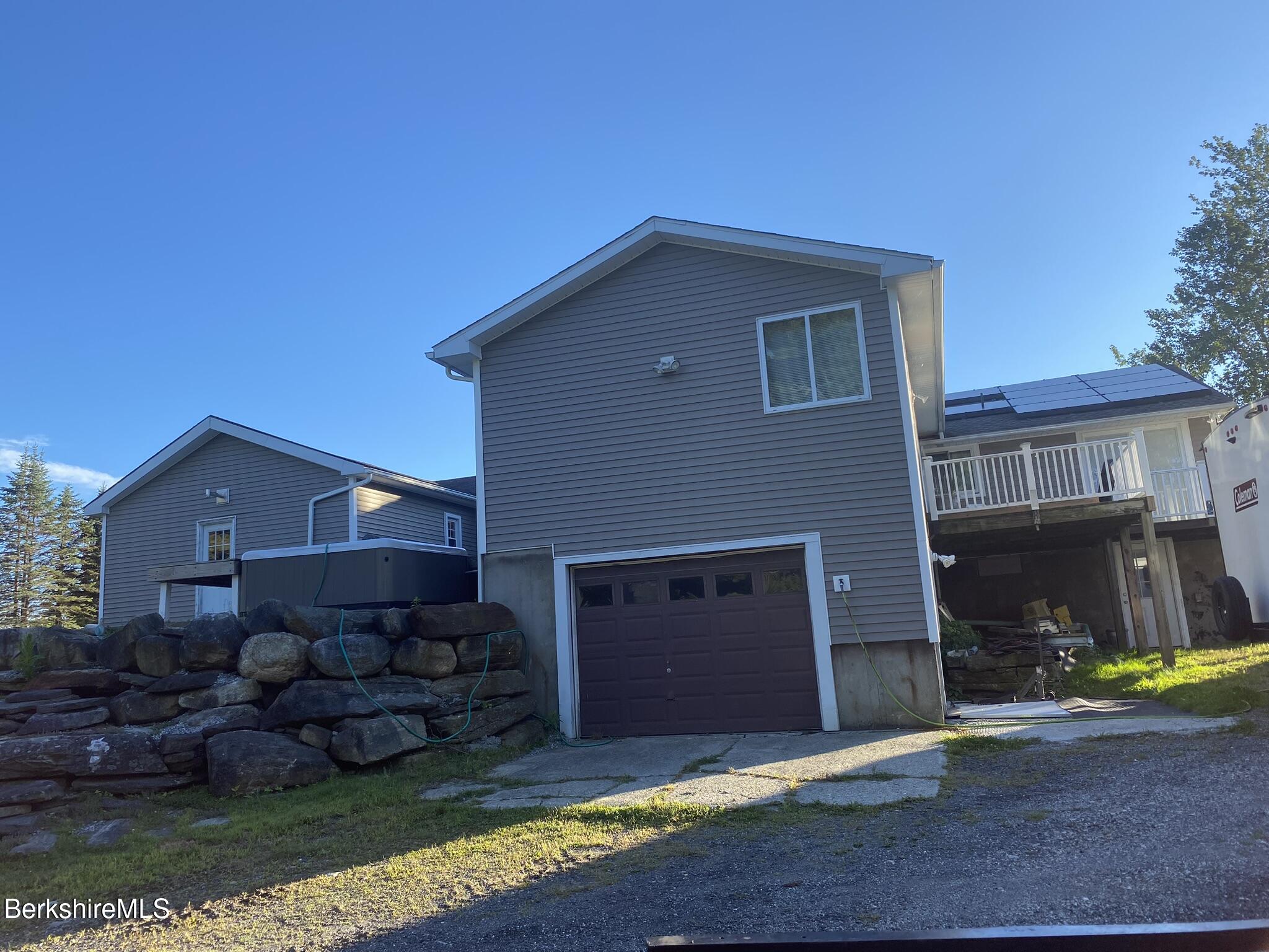 554 Main Street Becket, MA 01223 - Photo 28 of 36 a front view of a house with a yard