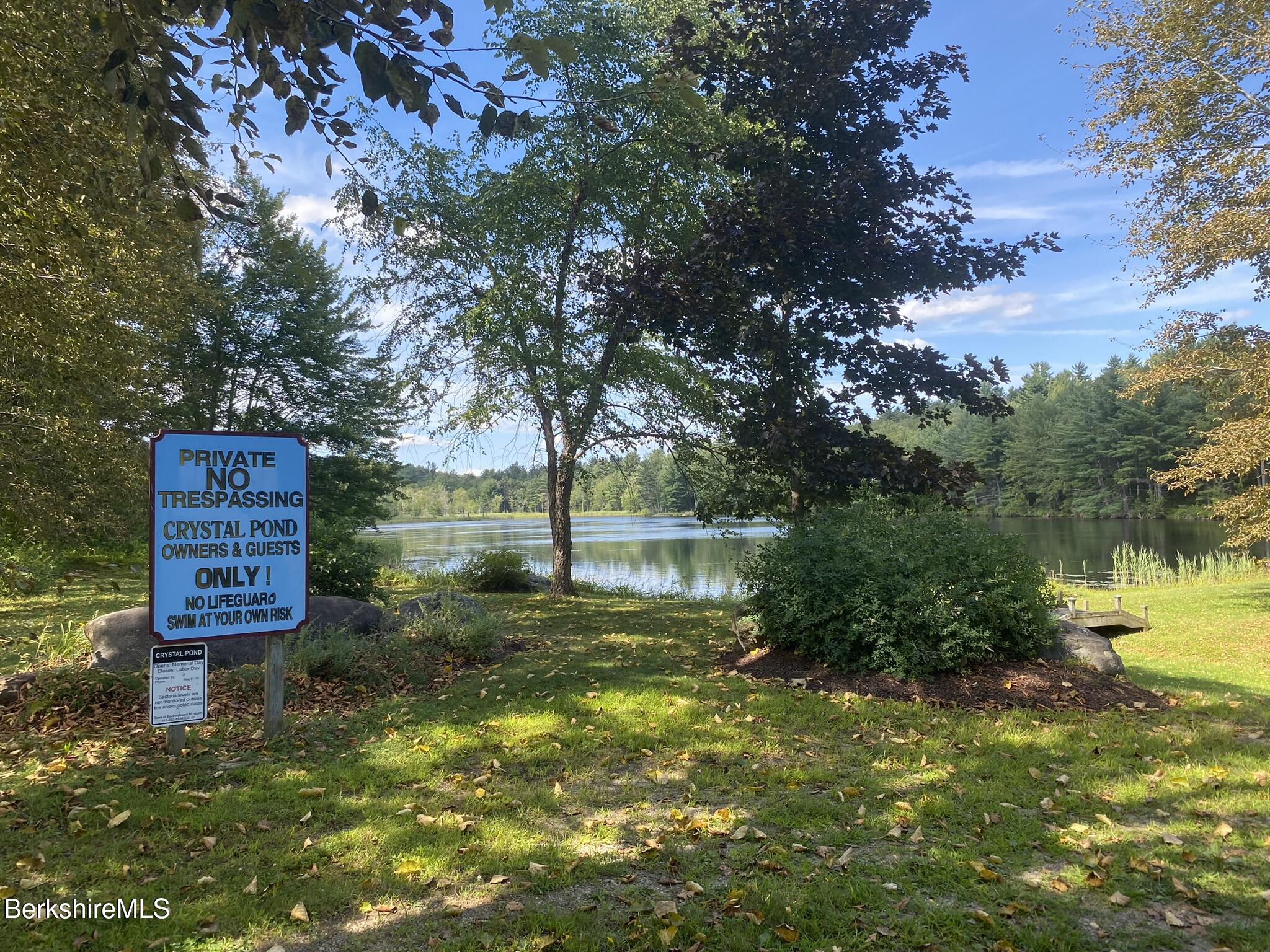 554 Main Street Becket, MA 01223 - Photo 36 of 36 a lake view with a house in the background