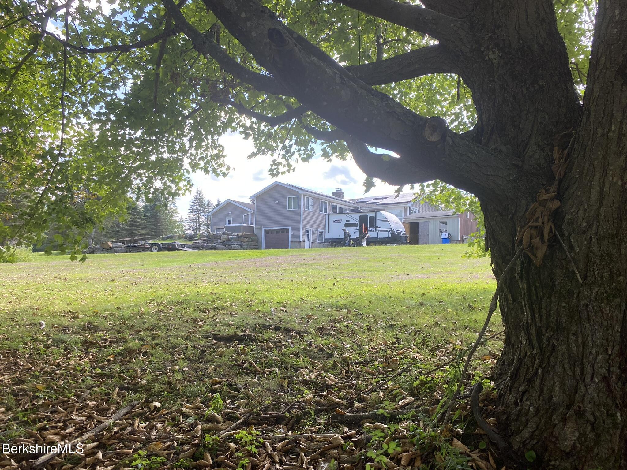 554 Main Street Becket, MA 01223 - Photo 6 of 36 a view of yard with swimming pool and green space