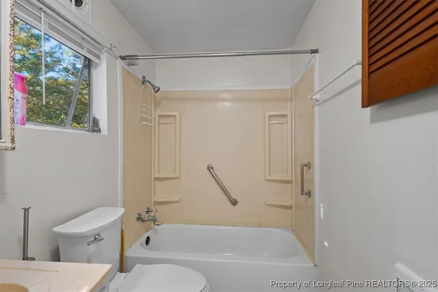 a bathroom with a toilet a sink and a bathtub