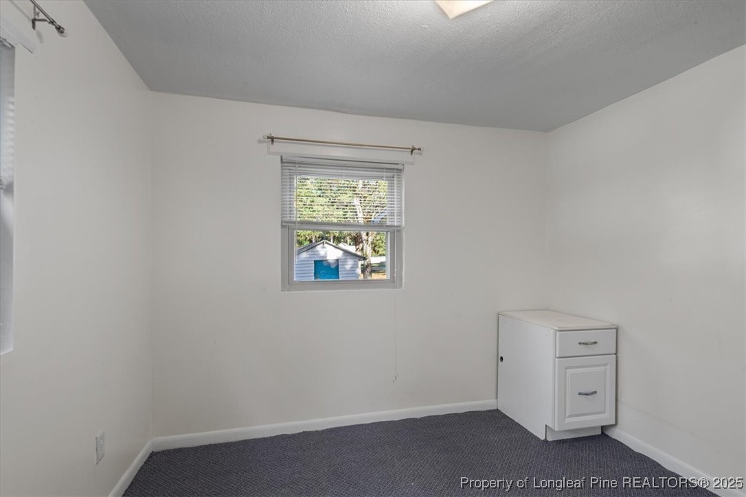 663 Possum Holler Road Eagle Springs, NC 27242 - Photo 19 of 21 an empty room with a window
