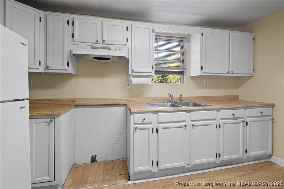 663 Possum Holler Road Eagle Springs, NC 27242 - Photo 7 of 21 a kitchen with stainless steel appliances granite countertop a sink and cabinets