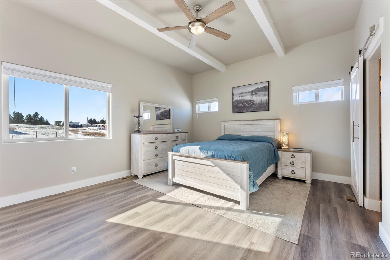 489 Duesouth Road Florissant, CO 80816 - Photo 15 of 40 a spacious bedroom with a bed and a cabinets