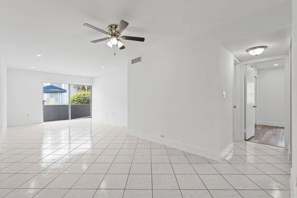 a view of an empty room and window