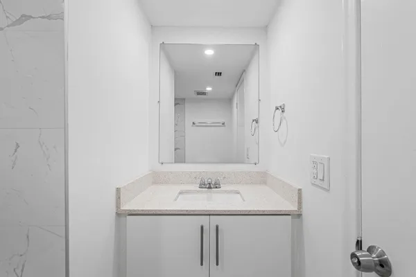 a bathroom with a sink and a mirror
