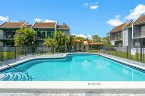 a view of a house with swimming pool