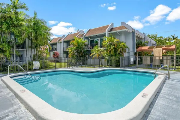 a view of swimming pool with outdoor seating