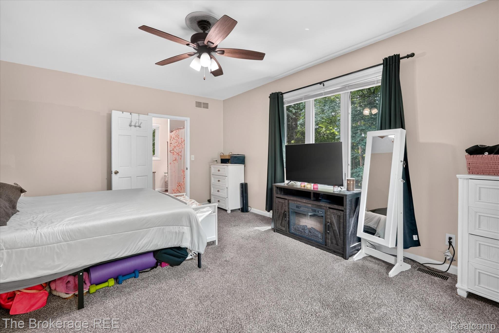 13269 North Genesee Road Clio, MI 48420 - Photo 27 of 67 Spacious room featuring neutral-toned walls, ceiling fan with integrated lighting, and carpeted flooring