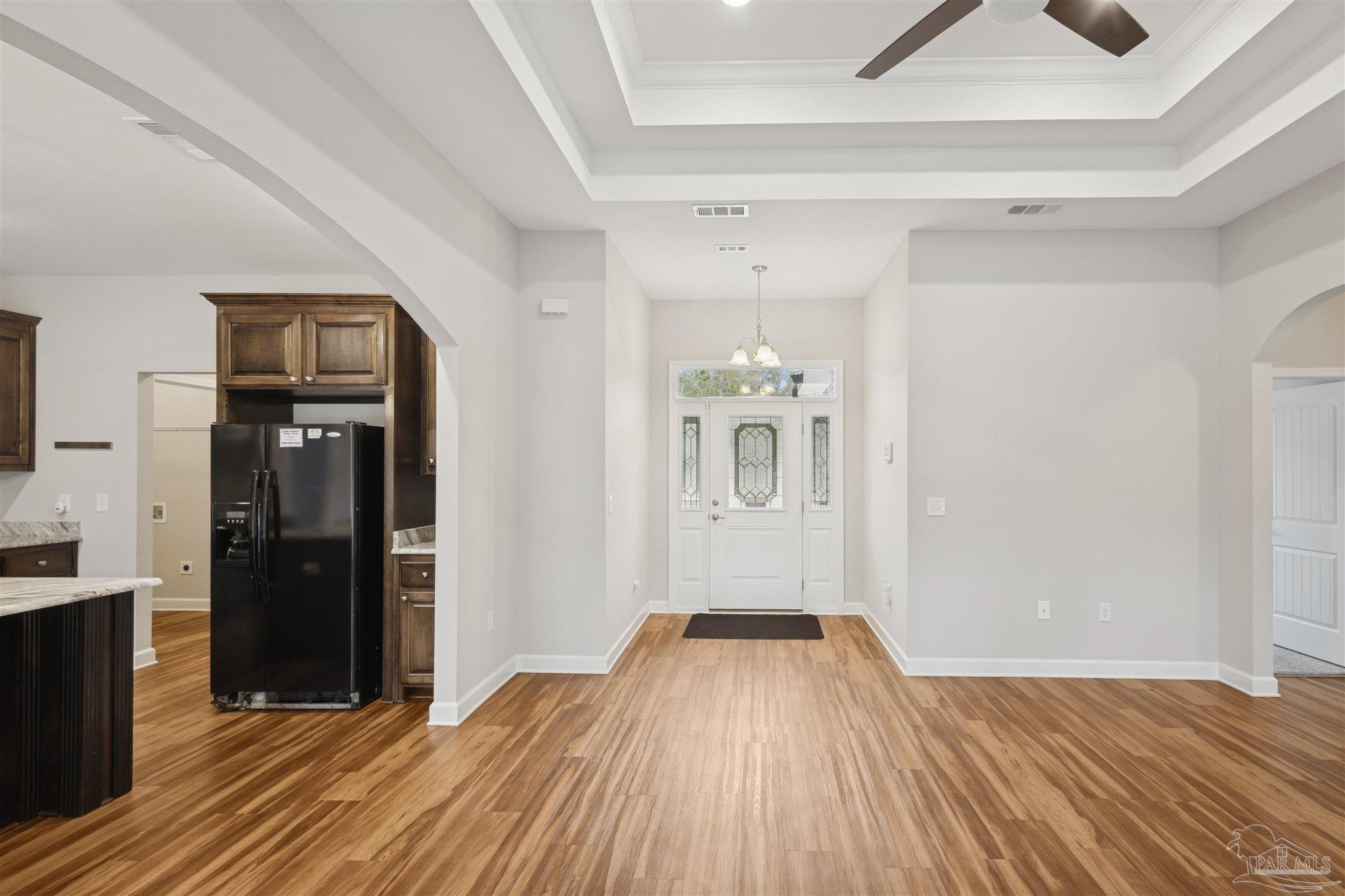 9855 Shangri La West Road Milton, FL 32583 - Photo 11 of 32 a view of a livingroom with wooden floor