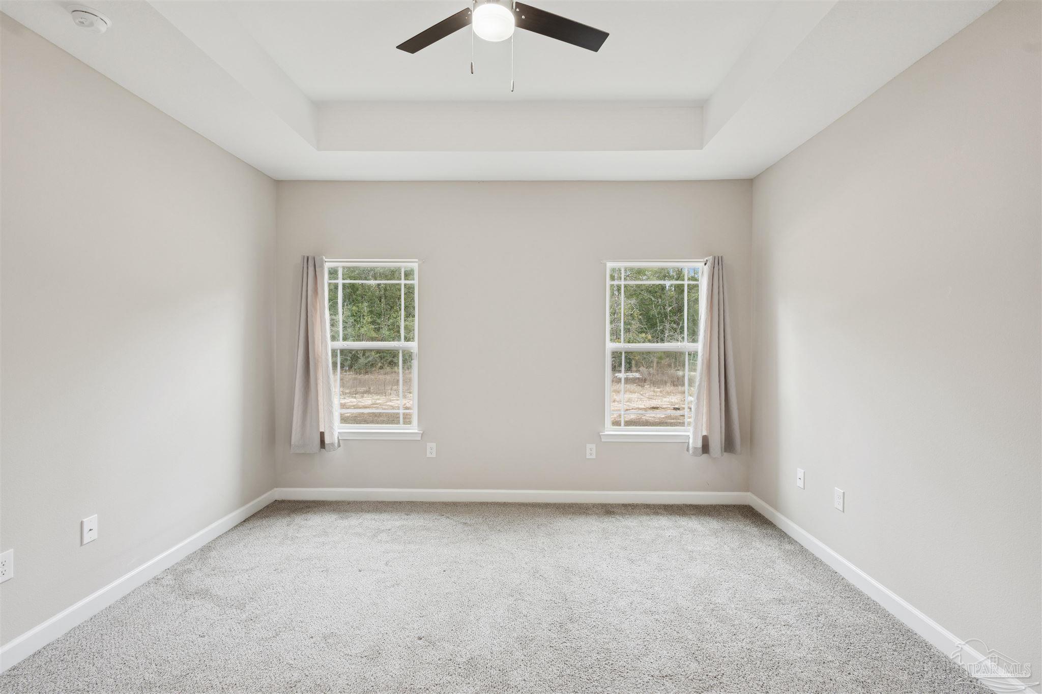 9855 Shangri La West Road Milton, FL 32583 - Photo 14 of 32 an empty room with a window