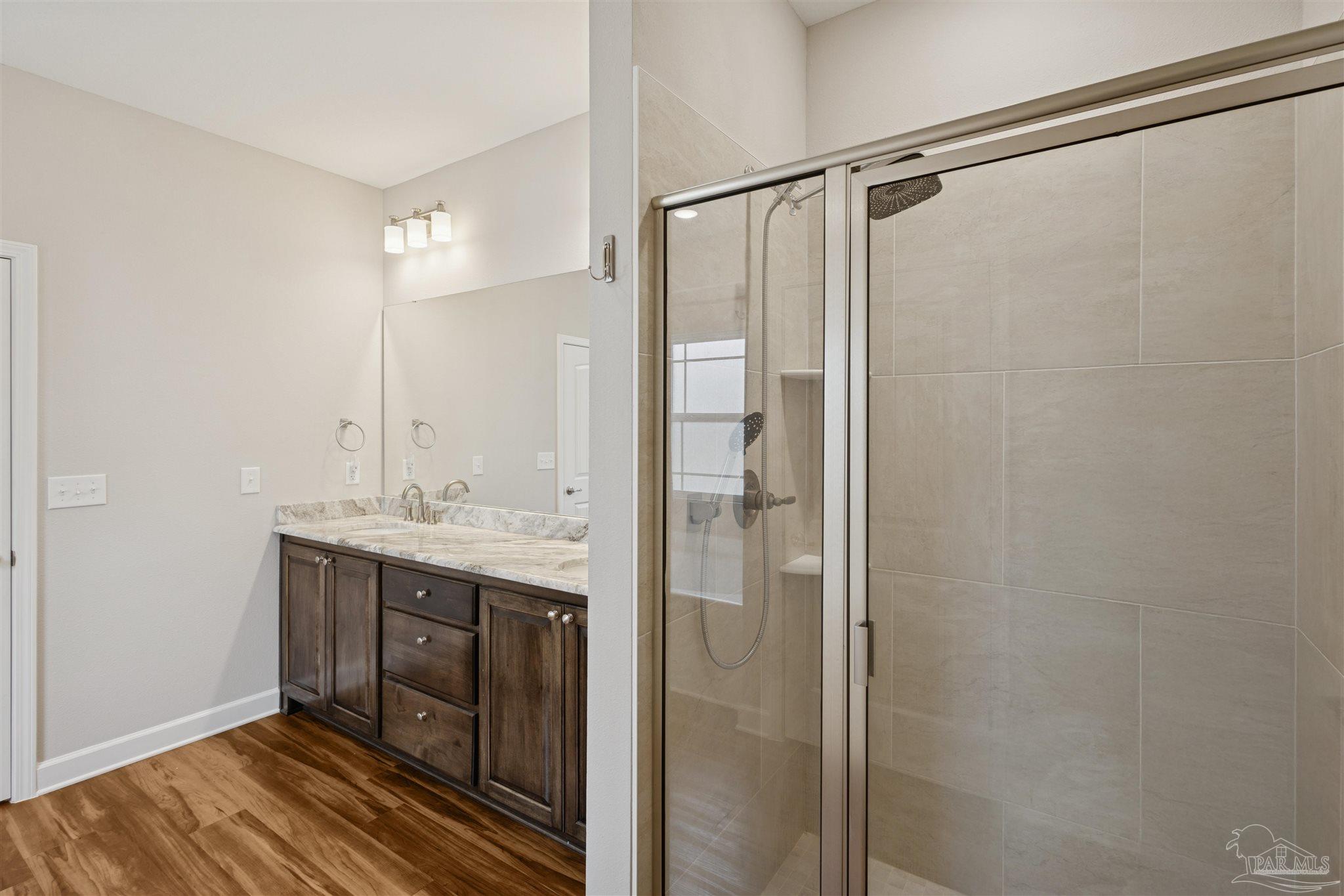 9855 Shangri La West Road Milton, FL 32583 - Photo 16 of 32 a bathroom with a shower and a sink