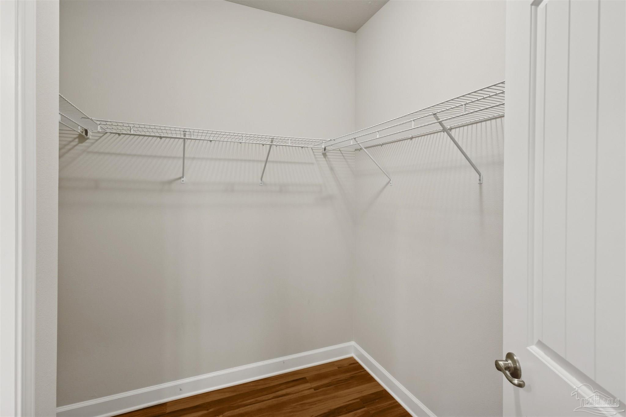 9855 Shangri La West Road Milton, FL 32583 - Photo 19 of 32 a view of a room with racks on the wall