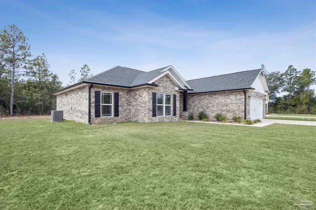 a view of a house with a yard