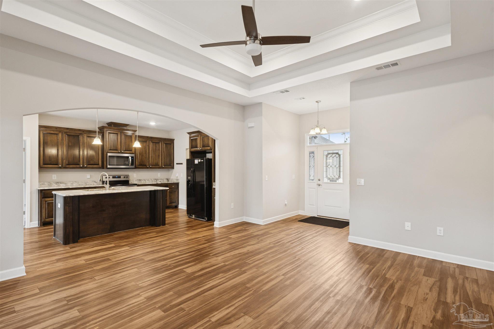 9855 Shangri La West Road Milton, FL 32583 - Photo 8 of 32 a view of kitchen with sink microwave and refrigerator