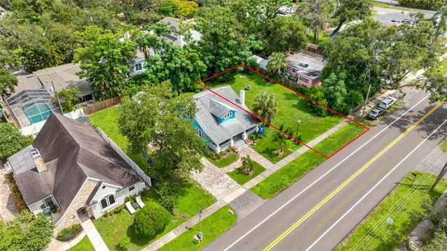 an aerial view of house with yard