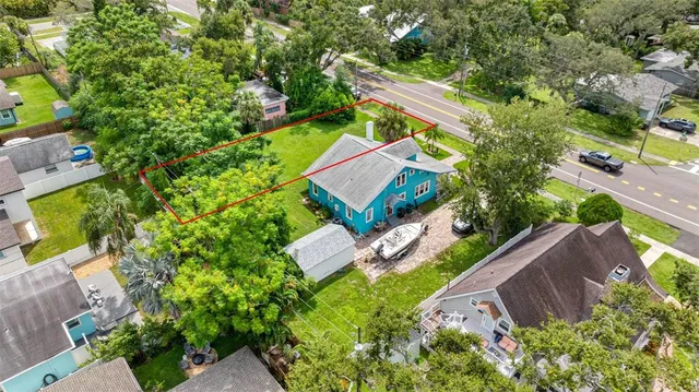 an aerial view of a house with a garden