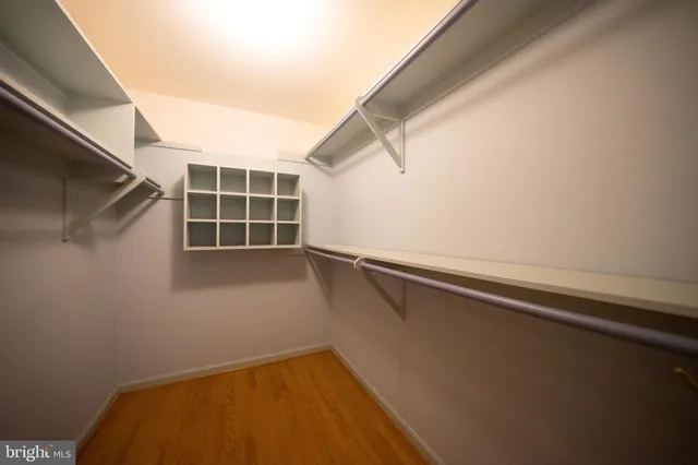 a view of a room with wooden floor and small space