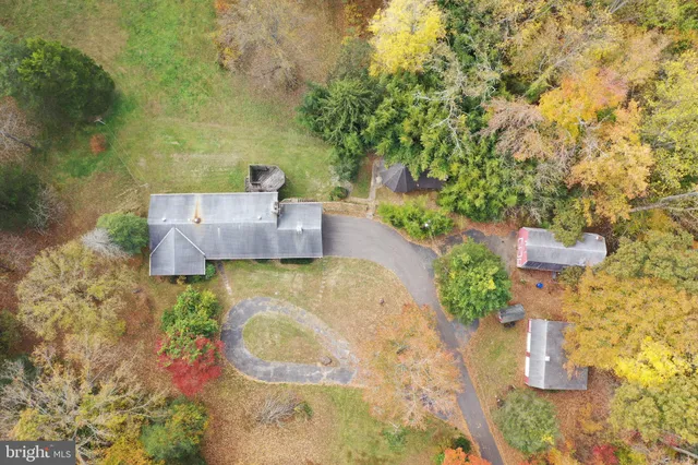 swimming pool view with a seating space