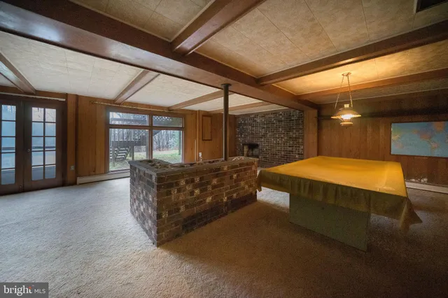 a bathroom with a sink a toilet a mirror and a tub