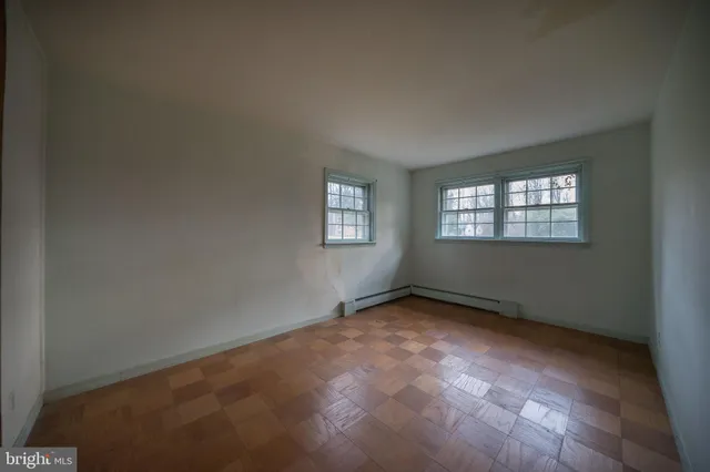 a view of an empty room with a fireplace