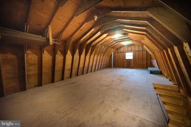 a view of a room with wooden walls
