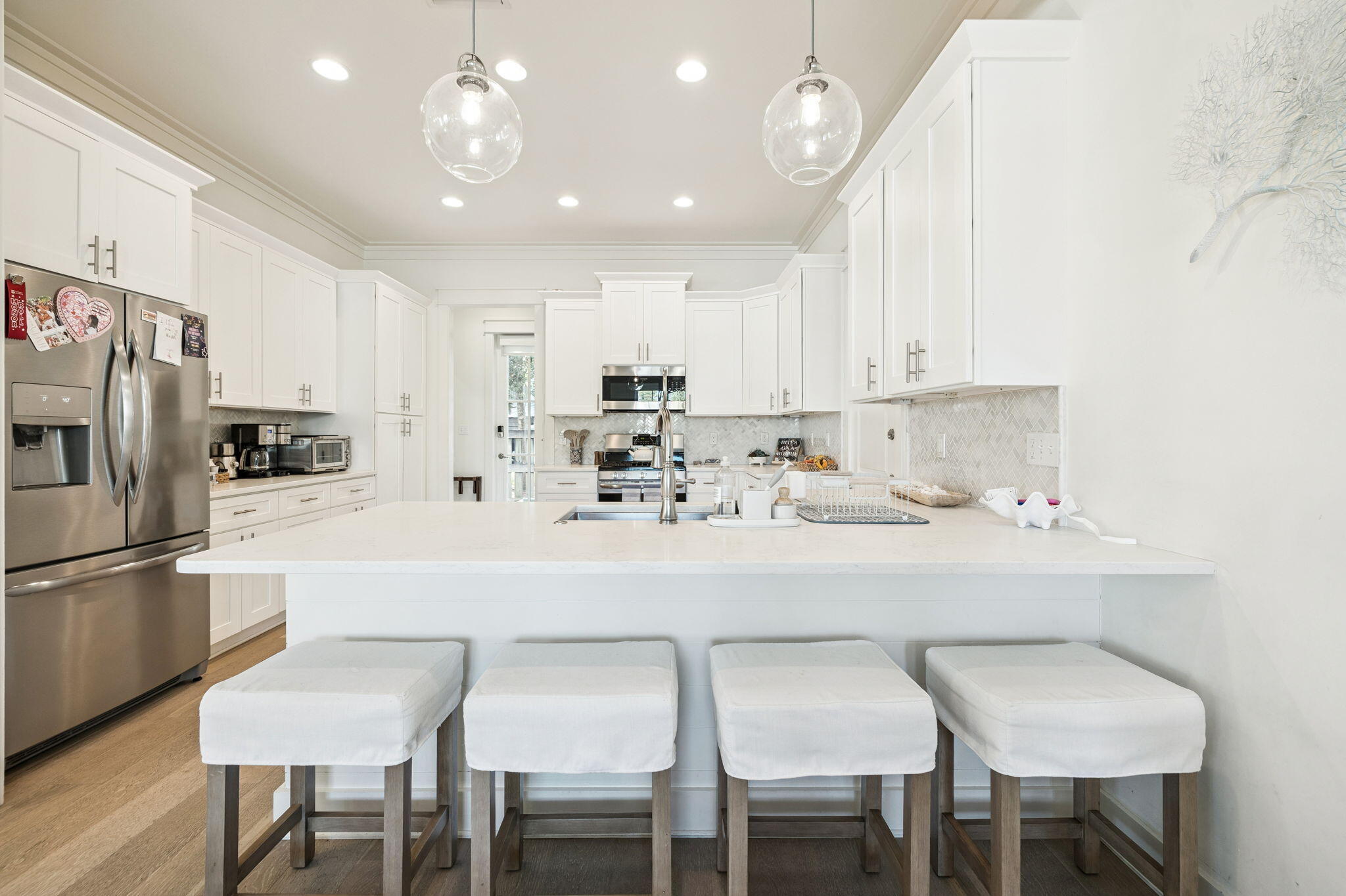 186 Cabana Trail Santa Rosa Beach, FL 32459 - Photo 21 of 51 a kitchen with kitchen island white cabinets and stainless steel appliances