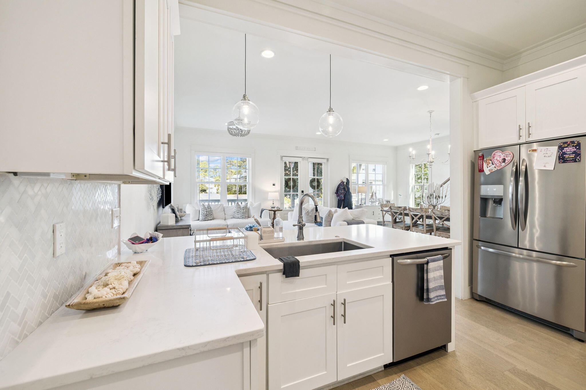 186 Cabana Trail Santa Rosa Beach, FL 32459 - Photo 23 of 51 a kitchen with kitchen island white cabinets and refrigerator