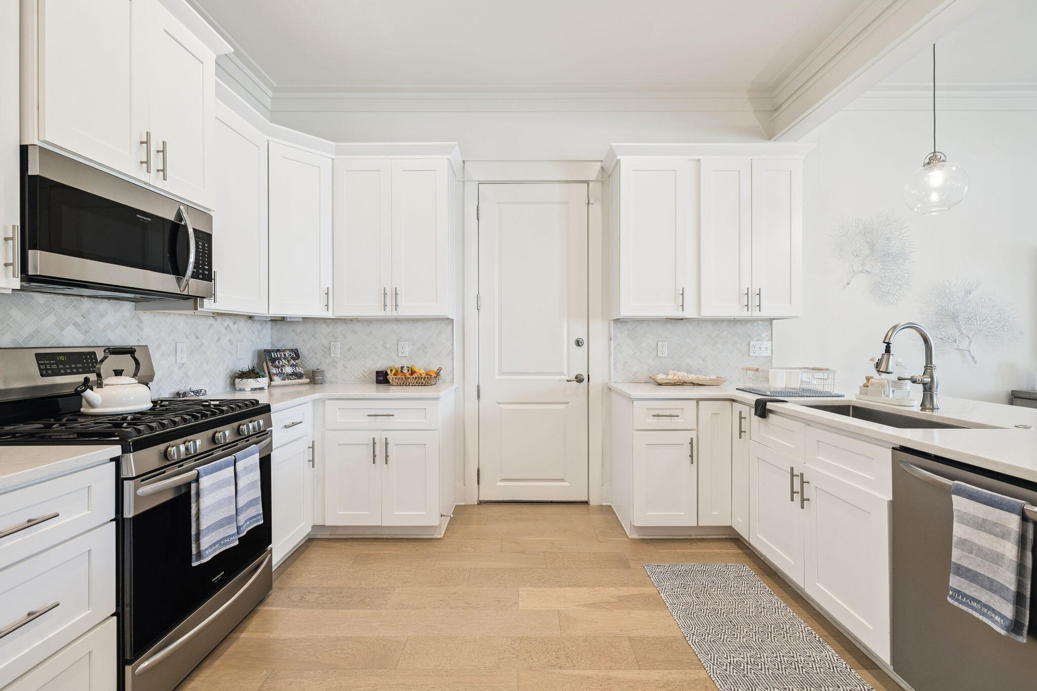 186 Cabana Trail Santa Rosa Beach, FL 32459 - Photo 25 of 51 a kitchen with white cabinets stainless steel appliances and sink