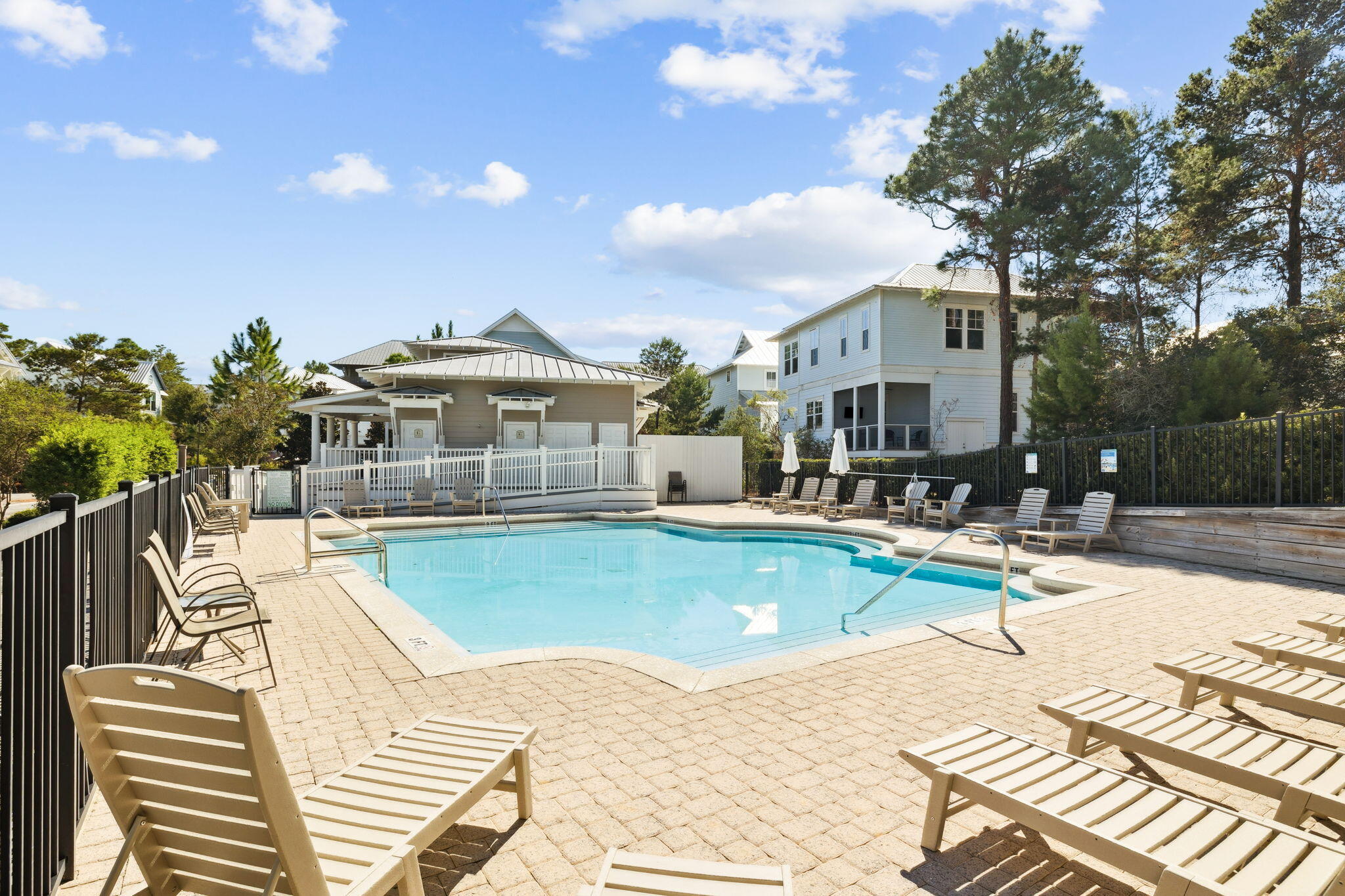 186 Cabana Trail Santa Rosa Beach, FL 32459 - Photo 48 of 51 a view of a swimming pool with a lounge chairs