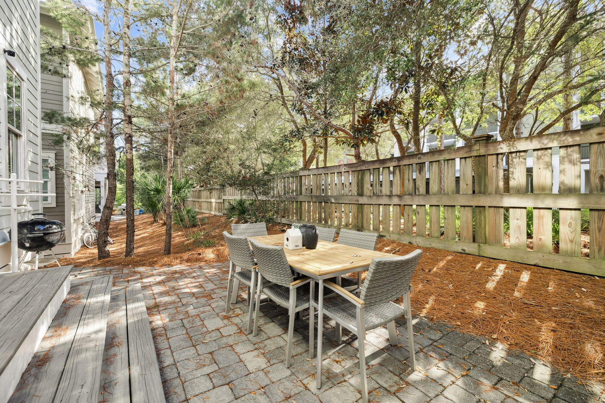 186 Cabana Trail Santa Rosa Beach, FL 32459 - Photo 9 of 51 a view of a patio with a table and chairs next to a yard
