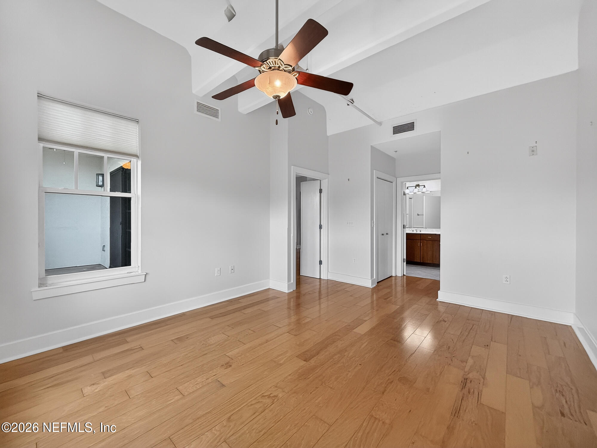 1661 Riverside Avenue, Unit 407 Jacksonville, FL 32204 - Photo 15 of 60 wooden floor in an empty room with a window