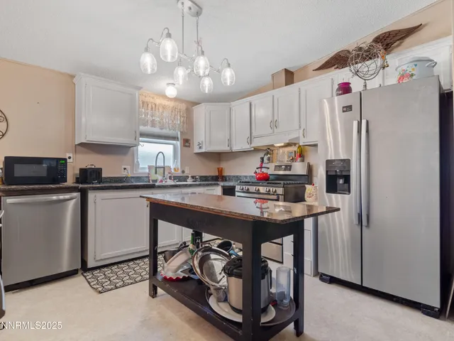 a view of kitchen island with furniture and wooden floor