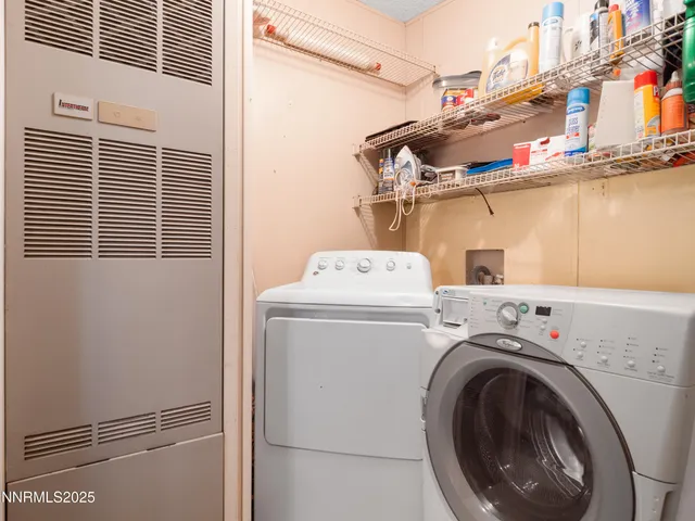 a bedroom with furniture and wooden floor