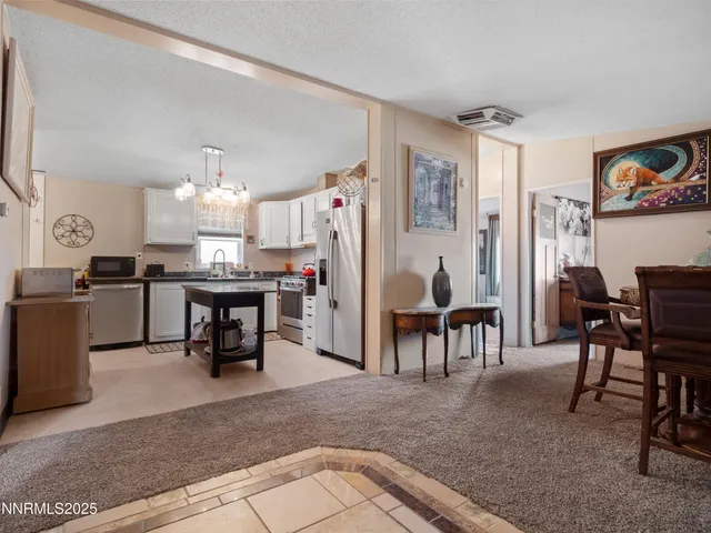 a kitchen with cabinets and window