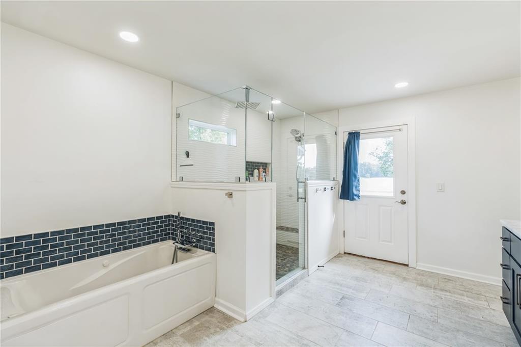 500 Coleman Mill Road Carrollton, GA 30116 - Photo 23 of 83 a bathroom with a bathtub and a shower