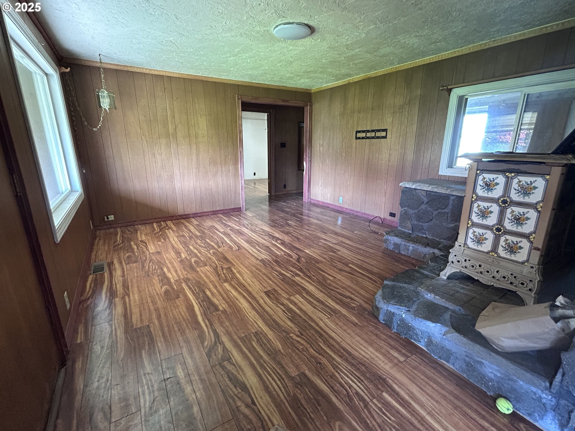 12403 South Eby Road Canby, OR 97013 - Photo 21 of 26 a view of a livingroom with wooden floor and staircase