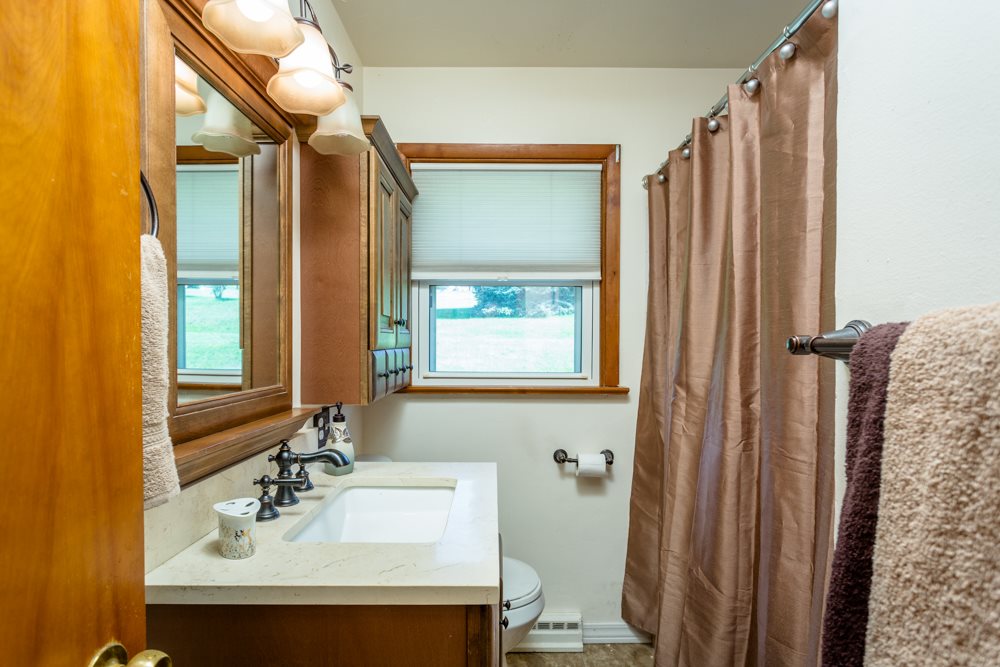 719 Middlebrook Road Staunton, VA 24401 - Photo 14 of 26 a bathroom with a sink and a mirror