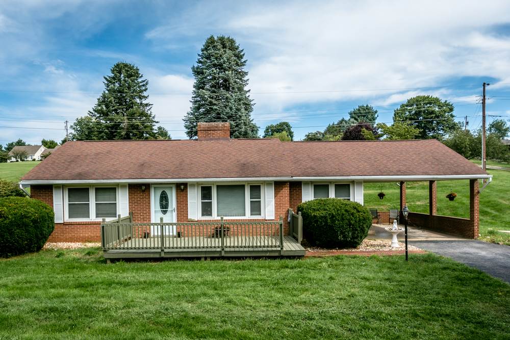 719 Middlebrook Road Staunton, VA 24401 - Photo 19 of 26 a front view of a house with a garden