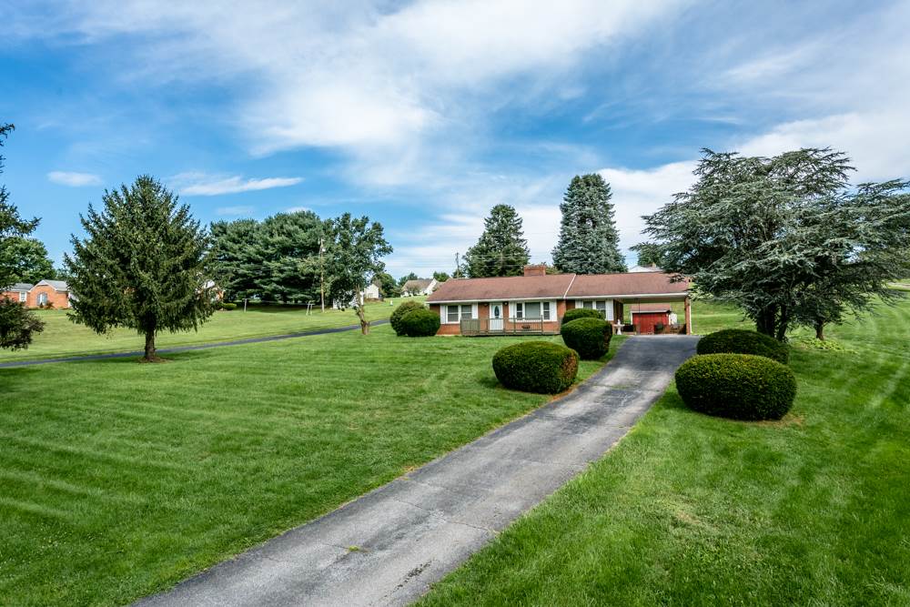 719 Middlebrook Road Staunton, VA 24401 - Photo 21 of 26 a view of a garden with a building in the background